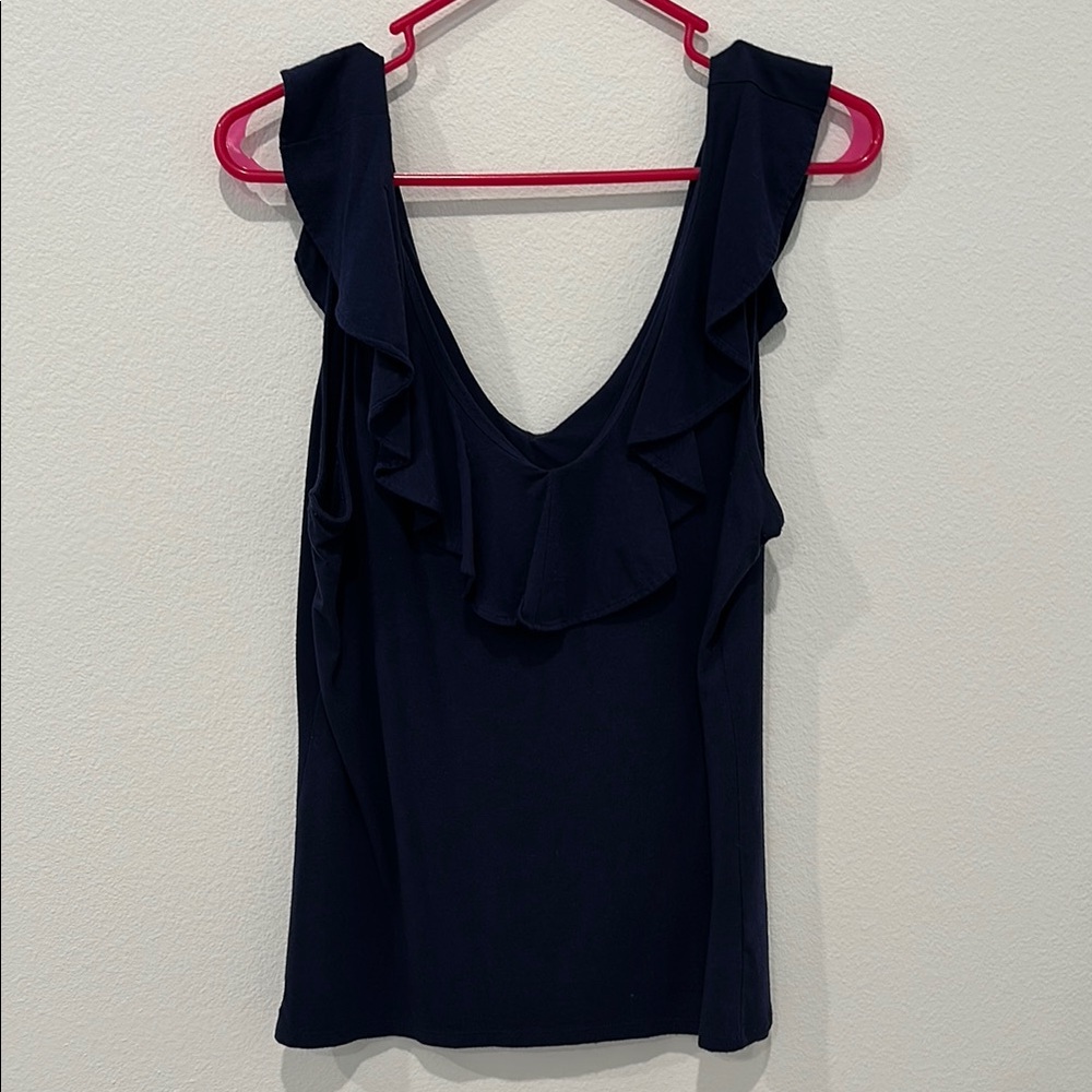 Navy sleeveless tank top with plunge neckline and ruffled details